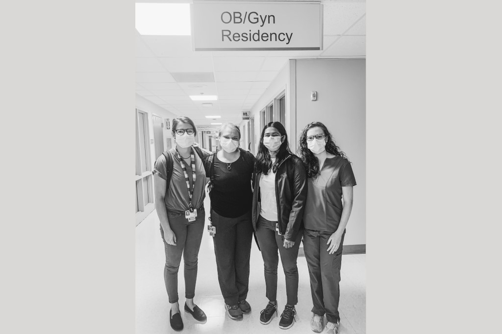Ob-gyn residents in a hospital hallway.